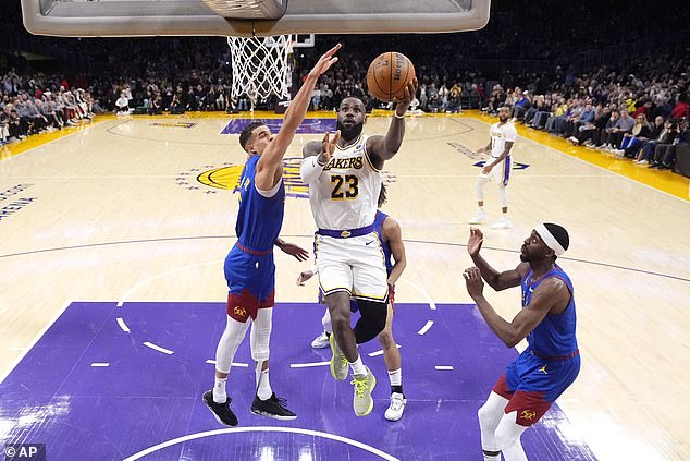 He used a spin move to create separation with Michael Porter Jr.  from Denver (left)