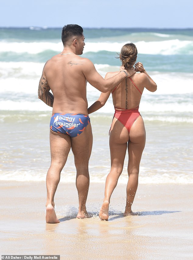 Her weightlifter beau, meanwhile, showed off his toned physique in a pair of blue Speedos adorned with a chilli print