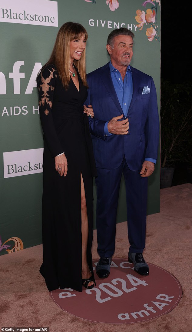 The couple, who have been married since May 1997, snuggled up next to each other as they took the spotlight on the red carpet