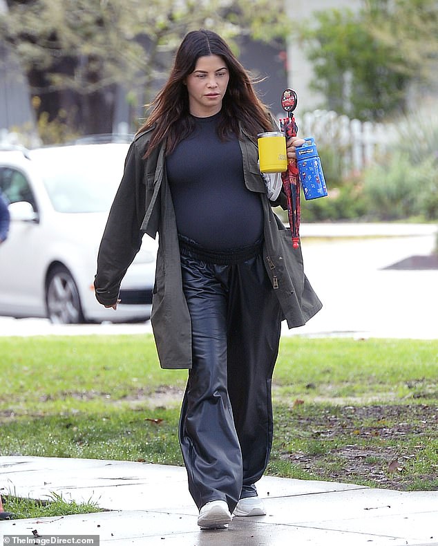 The 43-year-old star looked stunning in a sheer black bodysuit paired with stylish black leather track pants as she headed for a coffee run in Hollywood.