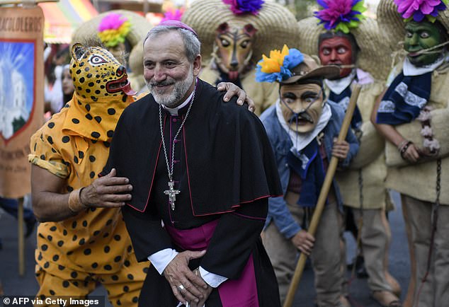 The Bishop of Guerrero posed with dancers and community members as they celebrated his arrival at his post in April 2022