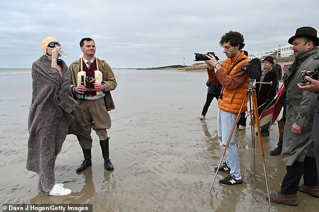 Victoria Summer and David Aitchison filming scenes for Vindication Swim on the beach in Brighton on April 6, 2021