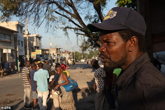 People gather outside the National Penitentiary in Port-au-Prince, Haiti