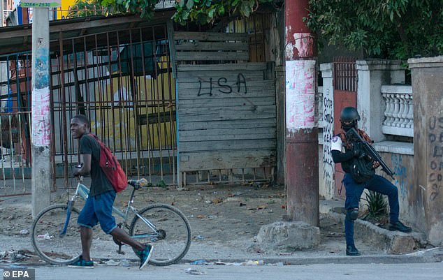 In the photo: A police officer stands guard during the ongoing civil unrest