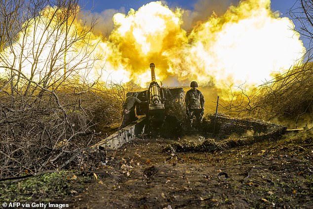 A Ukrainian soldier from an artillery unit fires at Russian positions outside Bakhmut