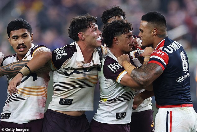 Broncos players, led by center Kotoni Staggs, rushed in to defend Mam after Roosters player Spencer Leniu's alleged comment