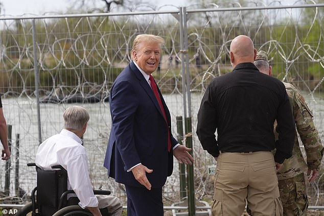 Republican presidential candidate, former President Donald Trump, gestures after waving to people across the Rio Grande in Mexico in Shelby Park during a visit to the US-Mexico border