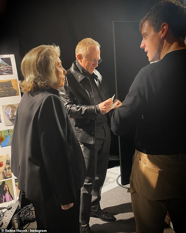 Hayek's husband, billionaire businessman François-Henri Pinault (center) also attended the McQueen fashion show on Saturday evening