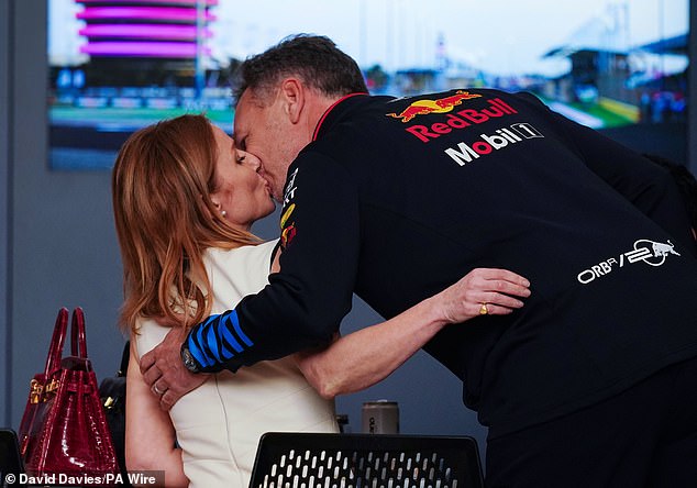 Halliwell kisses her husband on Saturday afternoon before the start of the Bahrain Grand Prix