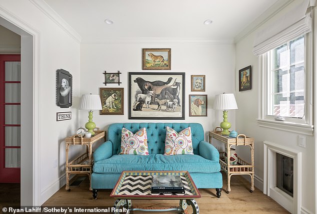 Despite the sleek modern touches, the house has its quirks, such as a smaller bathroom with blue-and-white floral wallpaper and a bright green sink