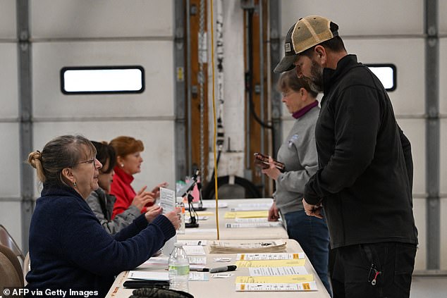 Voters pick up their ballots at the Philomont Fire Station on primary day in Philomont, Virginia