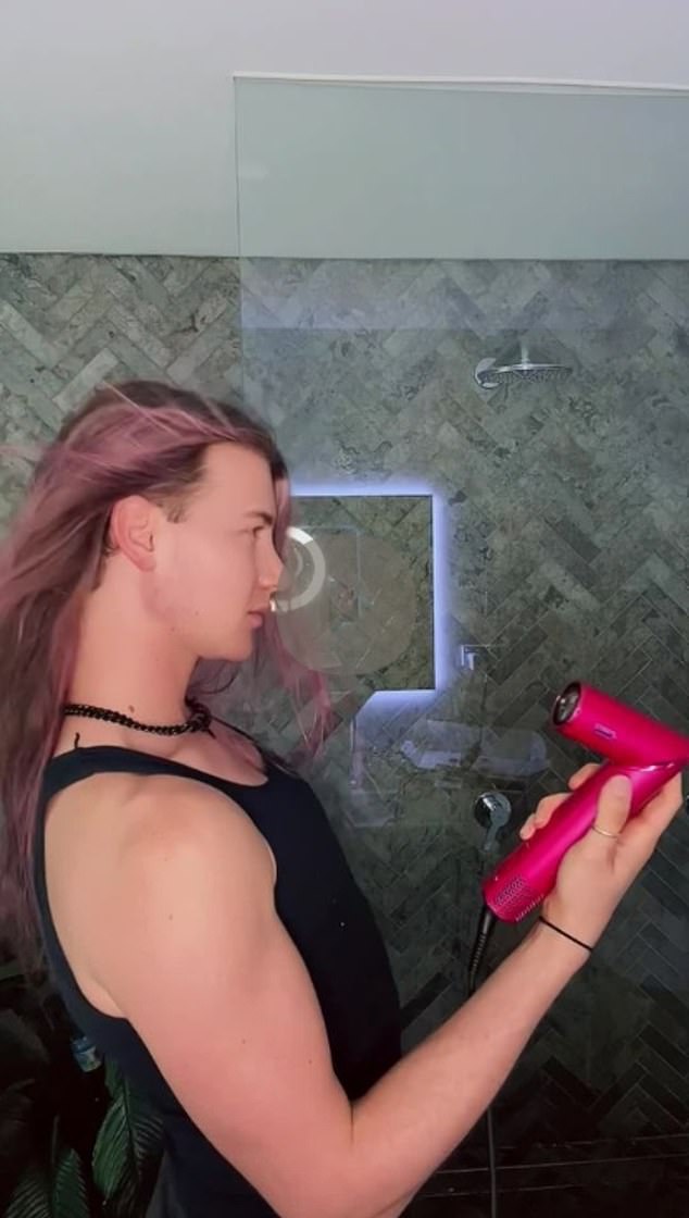 His brand new pink locks turned from wet to dry as he used the hair drying function