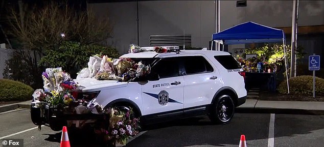 A patrol car was also covered in flowers in his honor and a memorial page has been created online to donate to his family