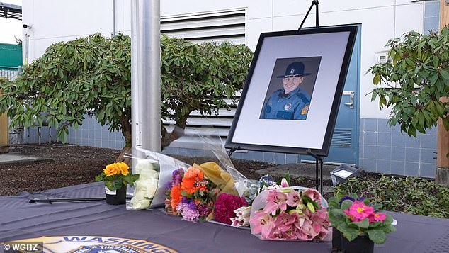 A memorial outside the state patrol headquarters in Marysville was erected in Gadd's honor with photos of him and flowers as mourners stopped by to pay their respects