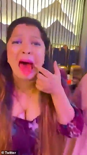 One of the guests shows her red tongue