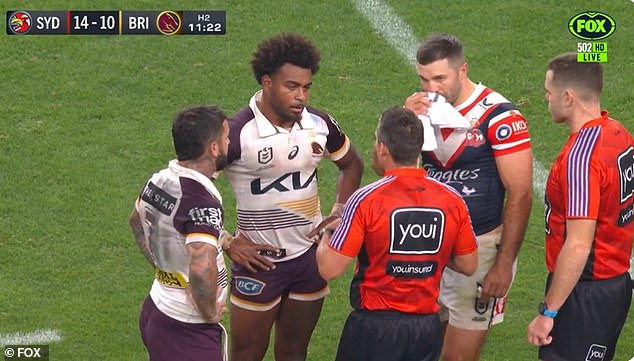Mom (second from left) is pictured making a complaint of racist abuse during his team's loss to the Roosters in Las Vegas last Sunday