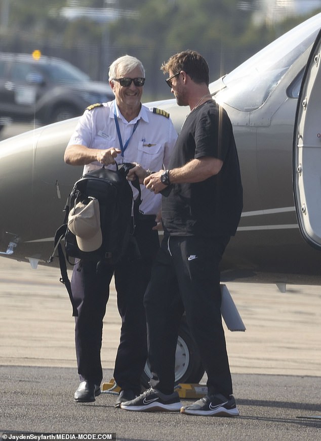 After disembarking, the father of three was greeted by his cheerful-looking pilot, who presented the star with a backpack