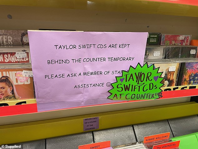 Taylor Swift CDs are being kept behind the counter in music stores across Australia after her recent concerts led to increasing numbers of CDs being stolen.  Two boards are shown in a JB Hi-Fi socket