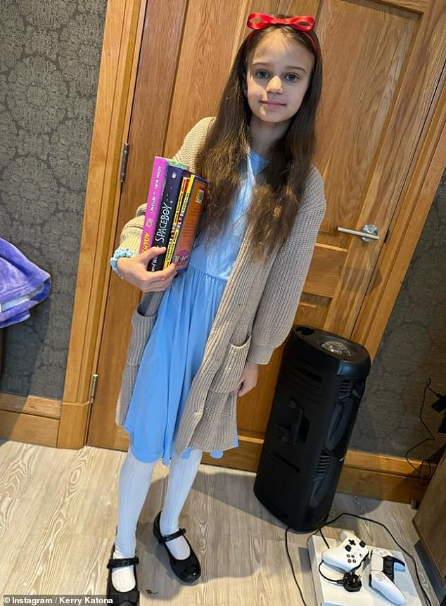 Kerry Katona's daughter DJ dressed as Matilda, another Roald Dahl classic, complete with a stack of her own favorite novels