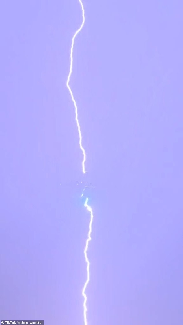 The lightning was so bright that the plane could barely be seen in the center of the lightning bolt