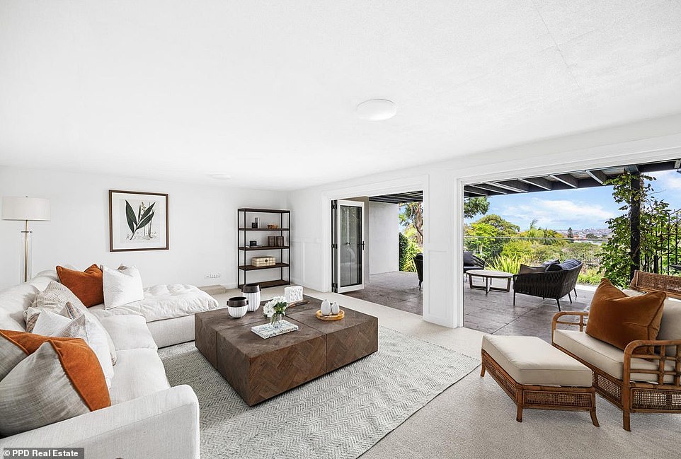 The basement also contains a wine cellar and a huge rumpus room connected via folding glass doors to a spacious outdoor area.