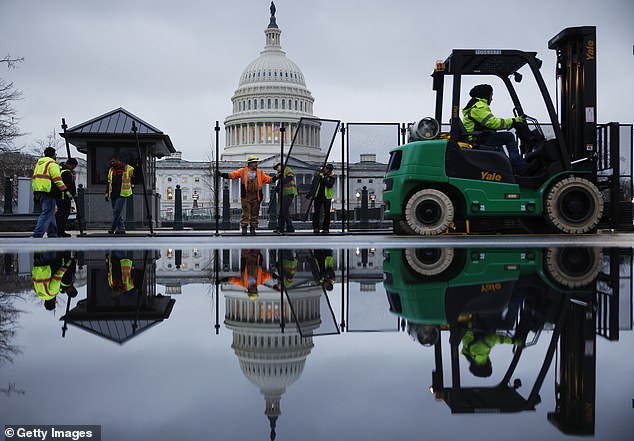 An 8-foot-tall steel fence will be installed around the U.S. Capitol the day before President Joe Biden is scheduled to deliver the State of the Union address