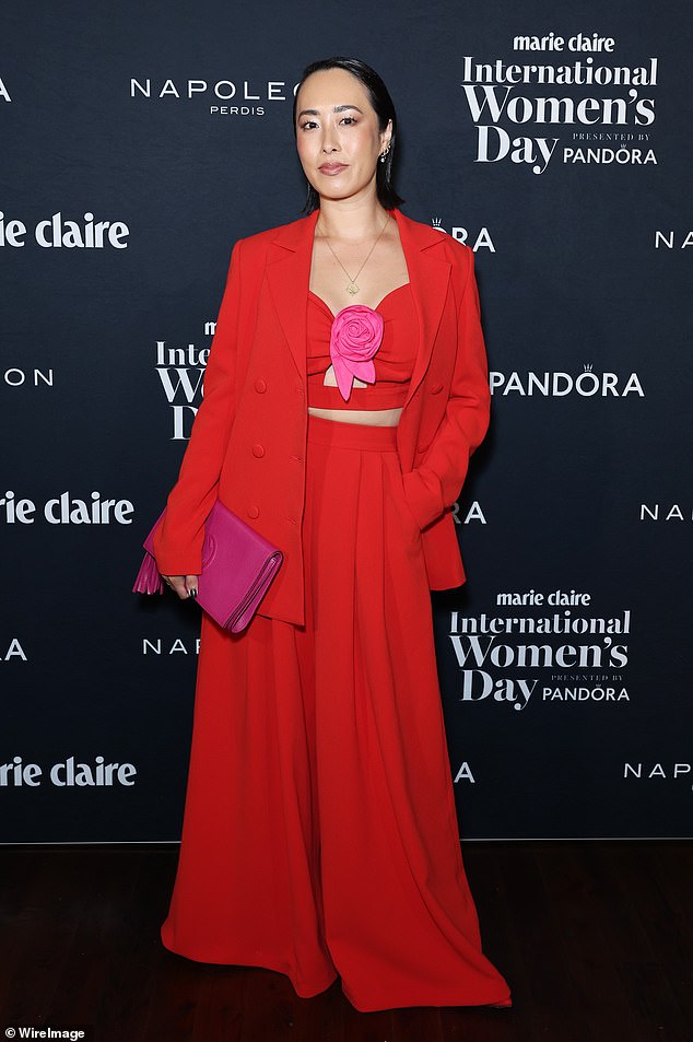 Former MasterChef Australia judge Melissa Leong dressed to impress in a red crop top with a pink flower on the front