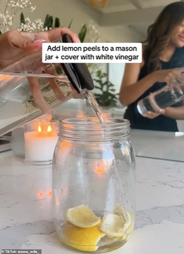 She puts lemon or orange peels in a mason jar, covers it with one to two cups of white vinegar and then leaves it for two weeks