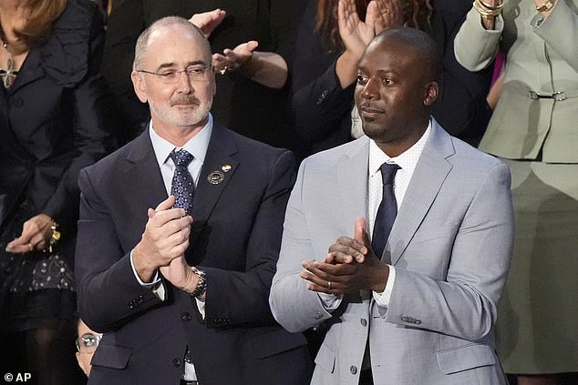 Keenan Jones (left), who benefited from the government loan forgiveness program, attended the State of the Union address as a guest of First Lady Jill Biden