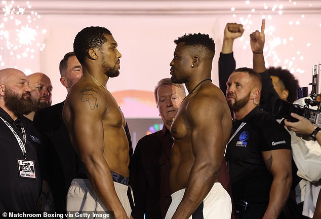 The main fight of the evening will see former world heavyweight champion Anthony Joshua (left) take on former UFC king Francis Ngannou (right, at the weigh-in)