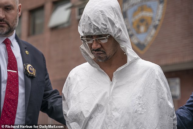 Johnson, pictured walking from the NYPD's 44th Precinct on Thursday, where he shouted, 