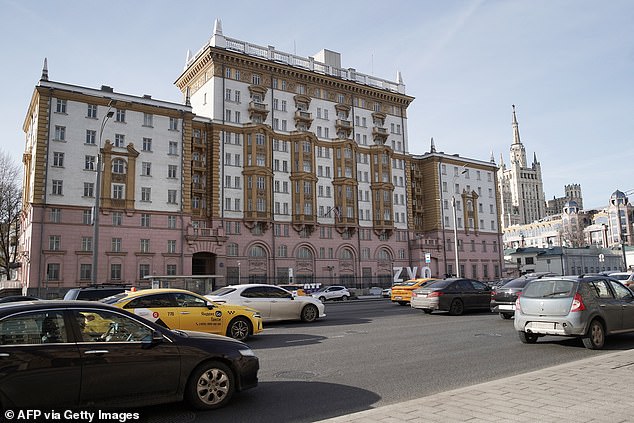 Cars drive past the US Embassy building in Moscow on March 7, 2024
