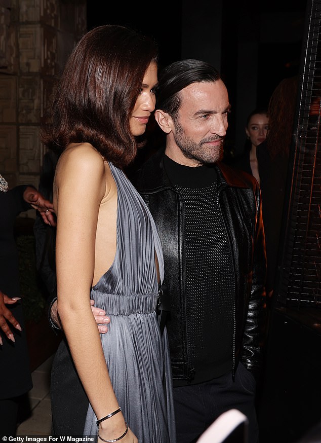 She posed with Louis Vuitton boss Nicolas Ghesquière, who looked dashing in black