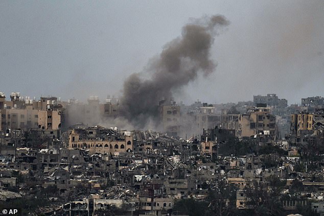 Smoke rises to the sky after an explosion in the Gaza Strip, seen from southern Israel, Friday, March 8, 2024