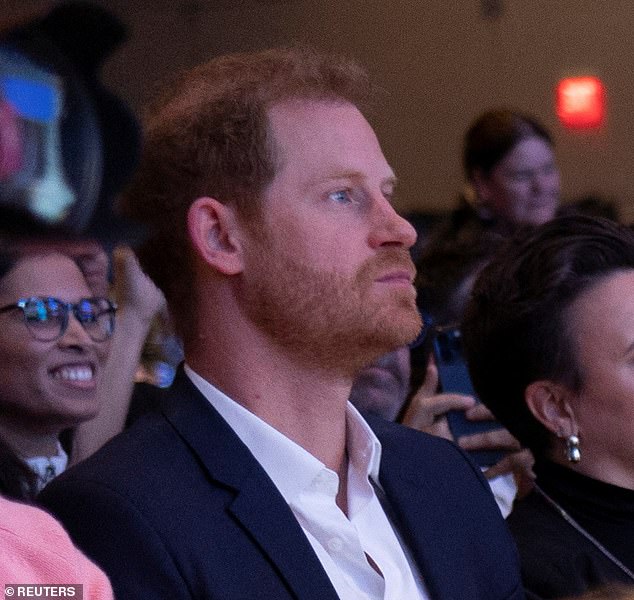 Harry is seen in the audience supporting his wife Meghan as she speaks on the panel