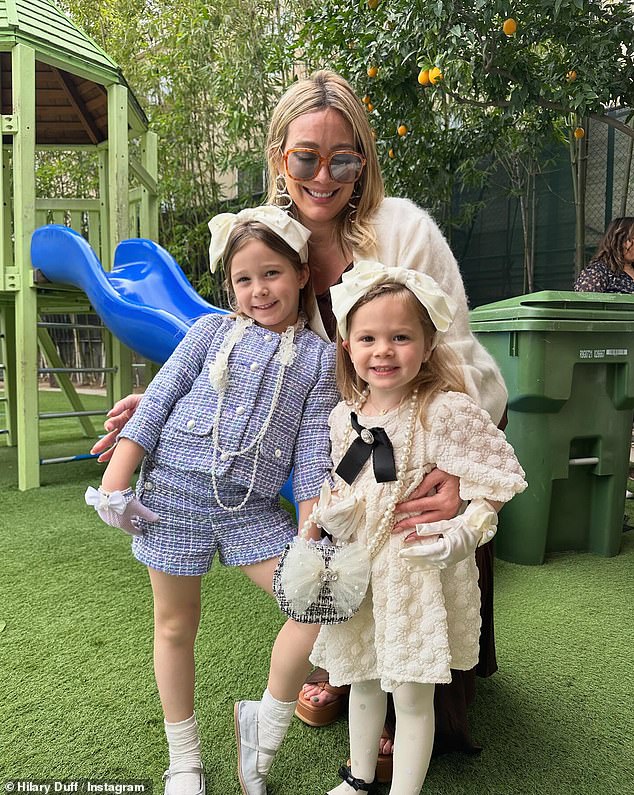 In one image, Hilary flashed a cheerful smile as she posed with Banks and Mae, who were dressed to the nines in cute outfits and pearl necklaces