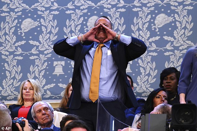 But a heckler shouts to interrupt President Joe Biden as he delivers the State of the Union address during a joint session of Congress