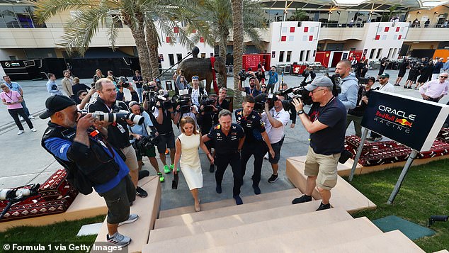 Christian Horner and Geri Horner walk hand in hand through the Paddock prior to the Bahrain Grand Prix