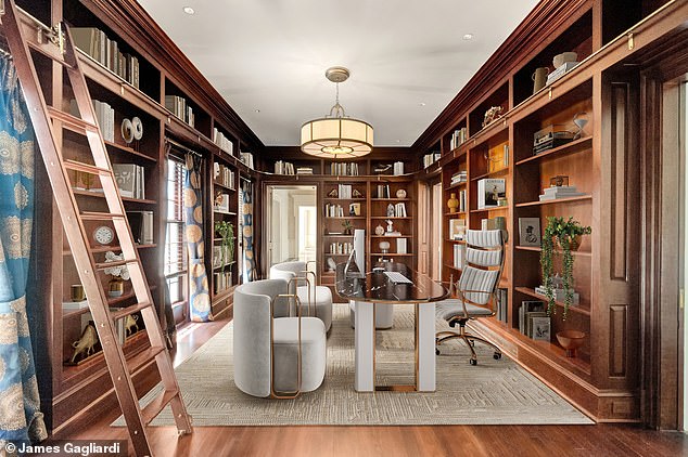 Featuring wall-to-wall bookcases including a mobile ladder and a work station overlooking the tranquil garden, the enormous library and private office are ideal for home office workers