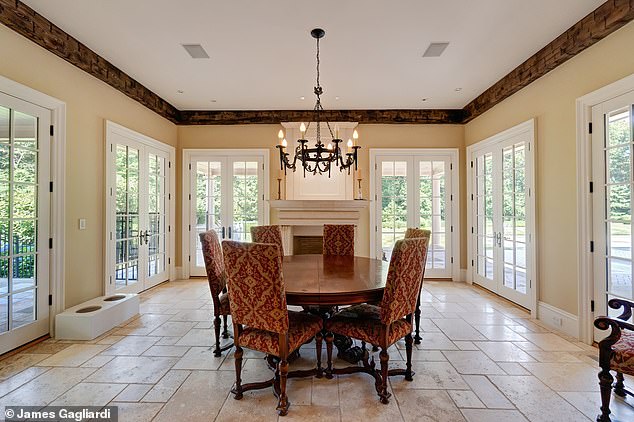 Adjacent to the kitchen is a small breakfast nook with 270 degree views of the grounds, as well as a larger dining room