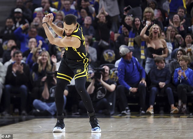 She accidentally photobombed a photo of Steph Curry's golf swing celebration