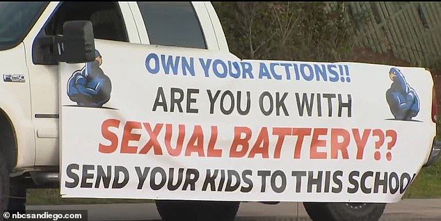 'Own your actions.  Are you okay with sexual battery?  Send your kids to this school,” reads the sign on the side of Poynor's truck