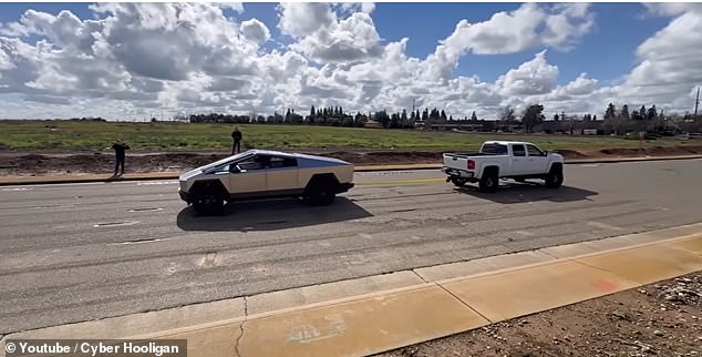 The video shows the truck giving up on the first try and letting the Silverado tow the 5,500-pound EV behind it