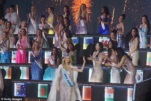 Miss World 2024 looks glamorous as she waves to the other contestants who cheer her on