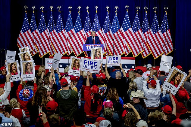 Supporters held up signs with Riley's image and the message 