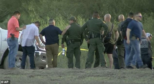 Authorities are seen at the scene of Friday afternoon's helicopter crash in Texas