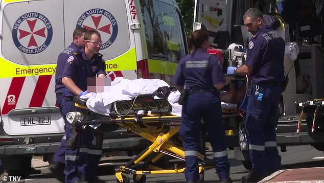 A man was found with a stab wound at a house on Rawson Road in Guildford at around 1.10pm.  The photo shows a man on a stretcher