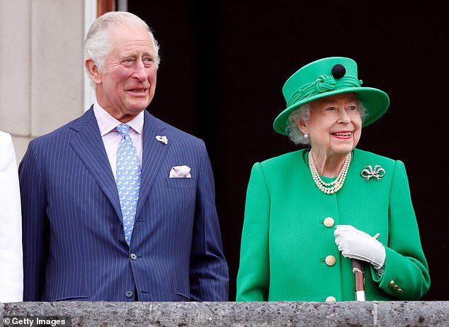 Charles and Queen Elizabeth II stand on the balcony of Buckingham Palace after the platinum pageant in June 2022