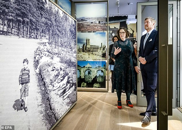 King Willem-Alexander (R) receives a tour as part of the opening of the National Holocaust Museum in Amsterdam