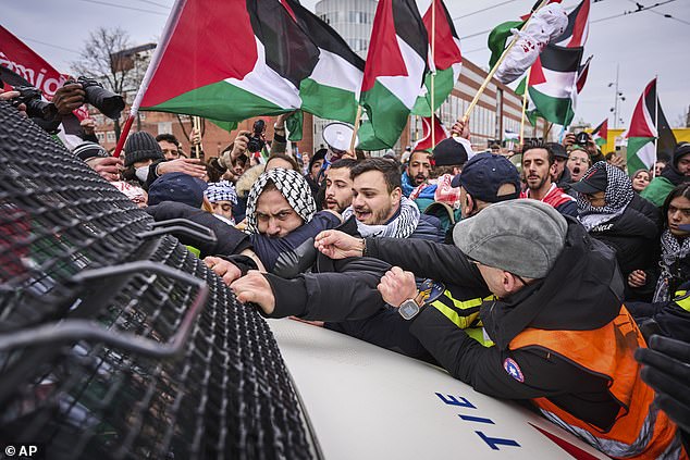 Demonstrators protest against Israeli President Isaac Herzog attending the opening of the new National Holocaust Museum in Amsterdam